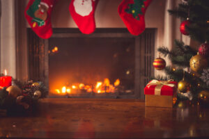 hardwood floors and a fireplace during the holidays