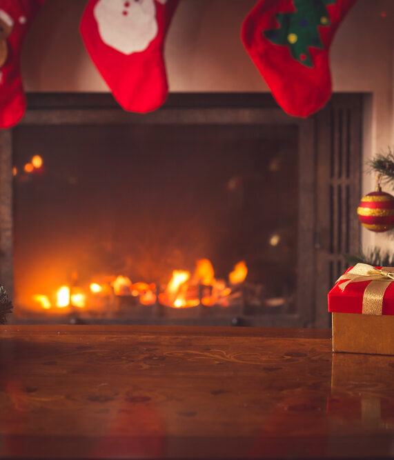 hardwood floors and a fireplace during the holidays