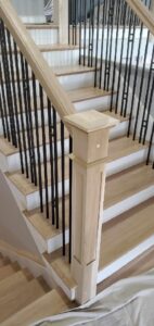 Custom staircase with White Oak and Rod Iron. Finished Two Coats Natural Sealer, 2 Coats Bona Traffic HD Satin
