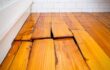 hardwood floor buckling warping cupping damage from winter moisture and weather for a professional like central mass hardwood to offer professional repair services