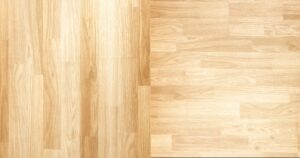 Side-by-side comparison of real hardwood flooring planks and luxury vinyl plank with similar wood-grain pattern.