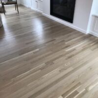 New 2 1/4" White Oak installed with two coats of Bona Natural sealer and two coats of Bona Traffic H.D. Satin finish