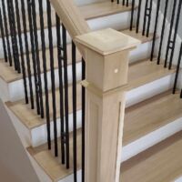 Custom staircase with White Oak and Rod Iron. Finished Two Coats Natural Sealer, 2 Coats Bona Traffic HD Satin